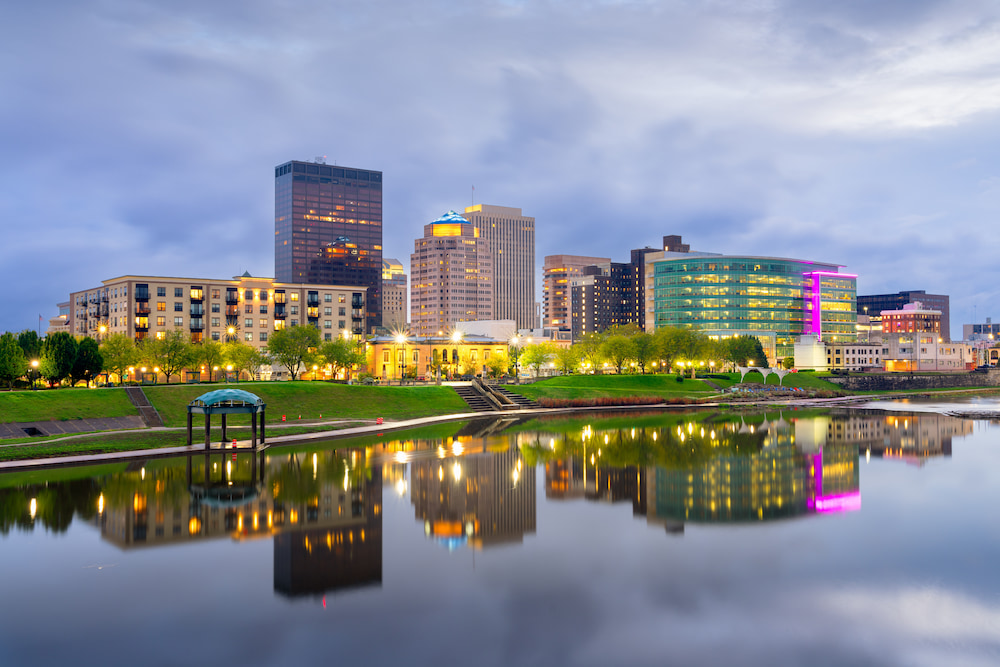 Dayton, Ohio, USA downtown cityscape on the Miami River at dusk.