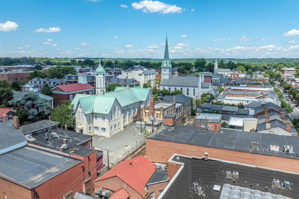Aerial view Fredericksburg Virginia with Circuit Court building , historic business district, Baptist church, Chatham bridge over Rappahannock River