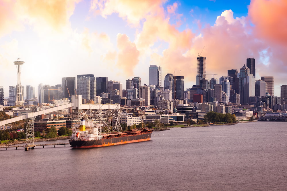 Downtown Seattle, Washington, United States of America. Aerial Panoramic View of the Modern City on the Pacific Ocean Coast. Dramatic Sunrise Sky Art Render.